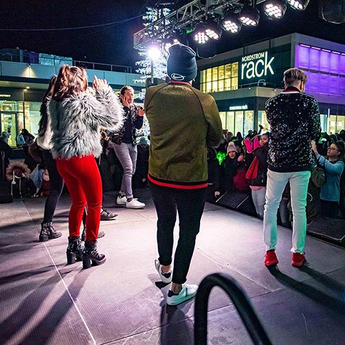 stage performance at Empire Outlets