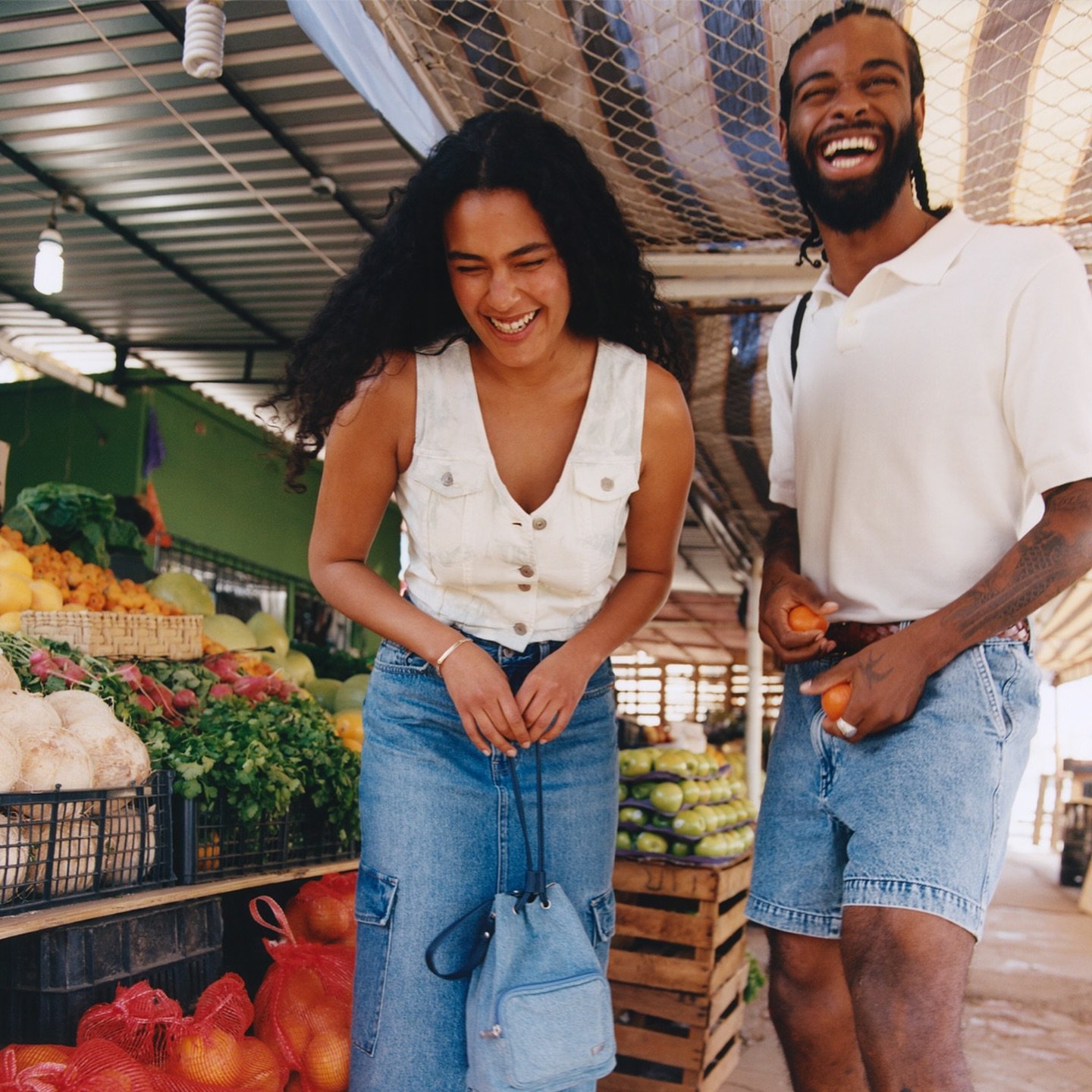 Two people wearing jeans from Levi's Outlet